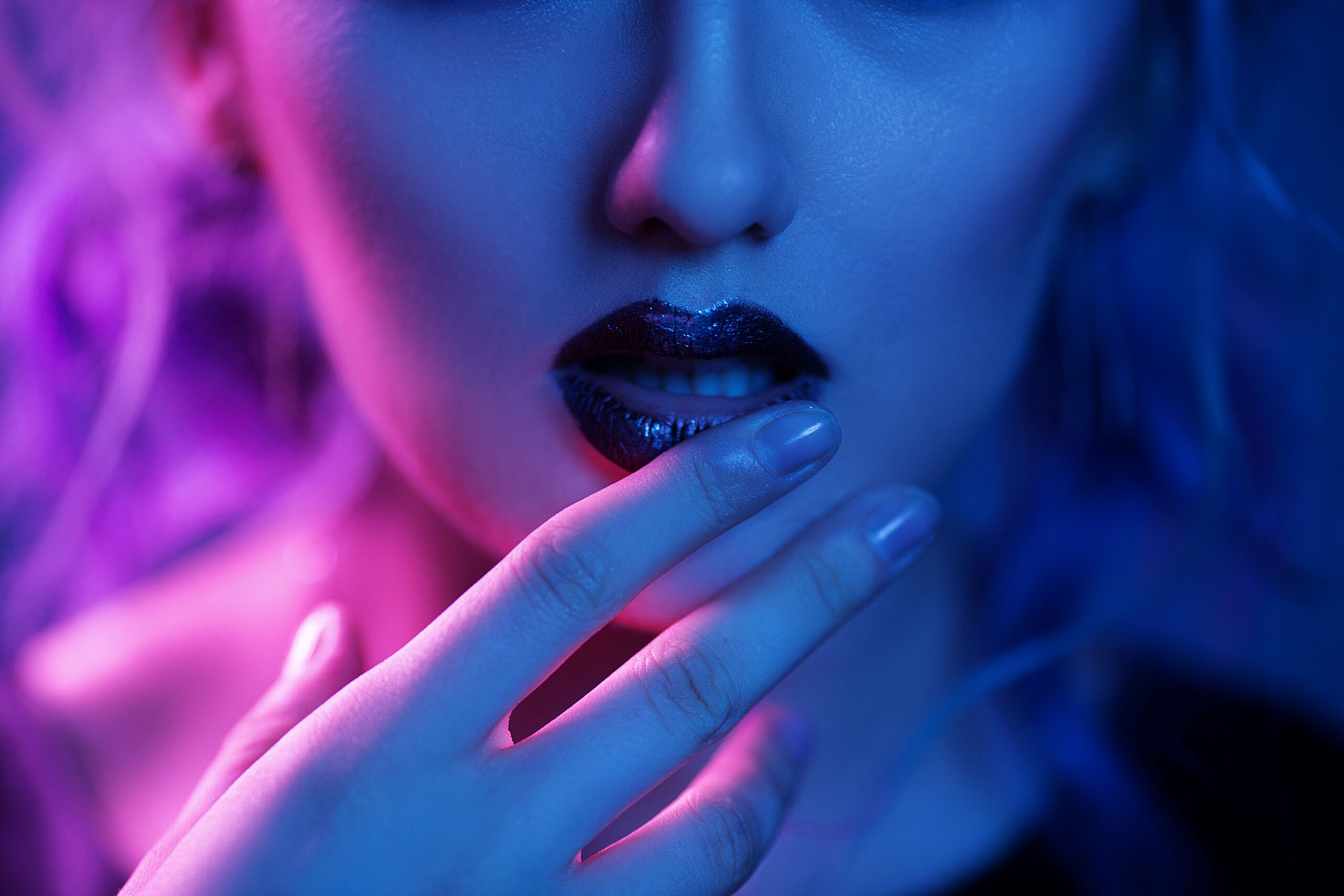 woman-touching-bright-lips